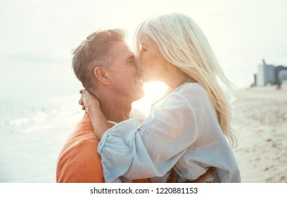 Happy senior couple spending time at the beach. Concepts about love,seniority and people - Powered by Shutterstock
