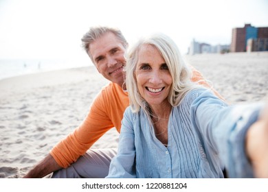 Happy senior couple spending time at the beach. Concepts about love,seniority and people - Powered by Shutterstock