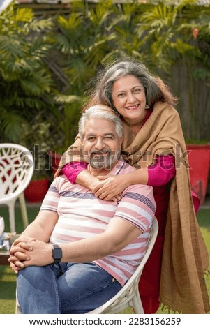 Similar – Image, Stock Photo Cheerful couple spending time together in living room