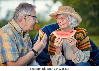 Happy Senior Couple.Smiling Mature Couple Eating Watermelon.