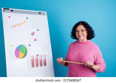 Happy Senior Female Leader Showing Drawing Chart Happy Showing Presentation,looking At Camera And Smiling