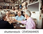 Happy senior friends eating at a cozy bistro together