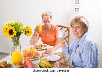 happy senior friends having breakfast - Powered by Shutterstock