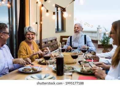 Happy Senior Friends Having Fun Dining Together On House Patio - Elderly Lifestyle People And Food Concept 