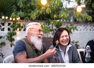 Happy Senior Friends Having Fun At Dinner House Party - Elderly Lifestyle People And Food Concept