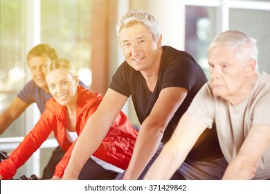 Happy Senior Group Together In A Spinning Class In Gym