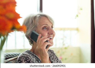 Happy Senior Lady Talking On The Phone