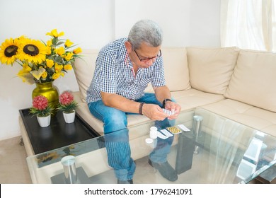 Happy Senior Man Checking Medicine