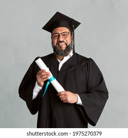 Happy Senior Man In A Graduation Gown Holding His Master Degree Mockup