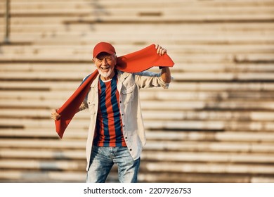 Happy Senior Man Having Fun While Going On Soccer Match And Looking At Camera. Copy Space.