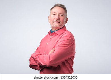 Happy Senior Man In Red Shirt Looking With Confidence.