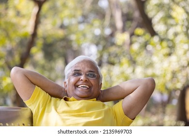 Happy Senior Man Relaxing At Park