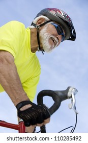 Happy Senior Man Riding Bicycle