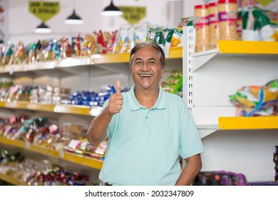 Happy senior man show thumbs up at grocery store products. - Powered by Shutterstock