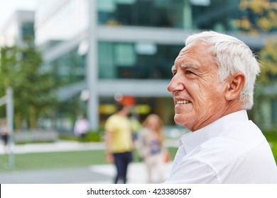 Happy Senior Man Sitting In Summer In The City