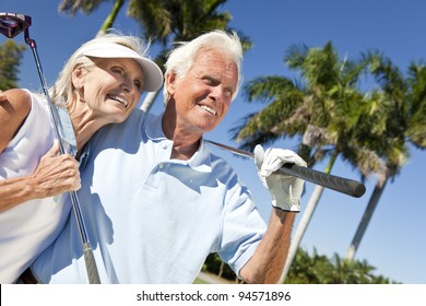 Happy Senior Man And Woman Couple Together Playing Golf Putting On A Green Together