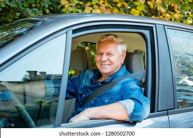 Happy Senior Man Working As Uber Taxi Driver, Smiling At Camera.