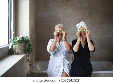 Happy senior mother in bathrobe with adult daughter indoors at home, selfcare concept. - Powered by Shutterstock