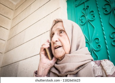 Happy Senior Muslim Woman Talking On Phone