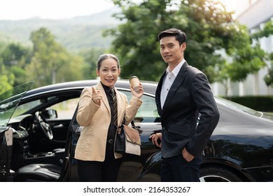 Happy Senior Old Asian Businesswoman And Young Asian Male Colleague At Car Park