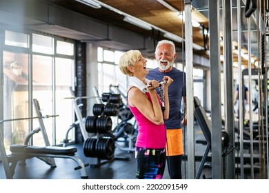 Happy senior people doing exercises in gym to stay fit. People sport concept. - Powered by Shutterstock