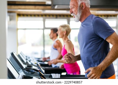 Happy senior people doing exercises in gym to stay fit. People sport concept. - Shutterstock ID 2229740857