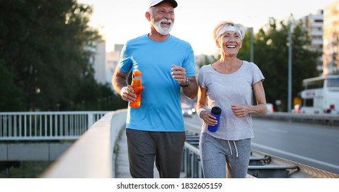 Happy Senior People Running To Stay Helathy And Lose Weight