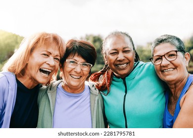 Happy senior people women after sport exercise workout having fun outdoors at park city - Focus on old female wearing eyeglasses - Shutterstock ID 2281795781