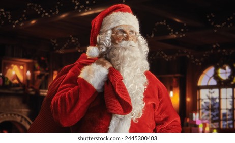 Happy Senior Santa Claus Posing at Festive Decorated Home, Holding a Big Red Bag with Gifts for Happy Children All Around Country. Christmas, New Year, Holiday Celebration Concept. - Powered by Shutterstock