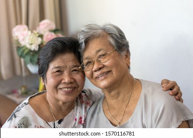 Happy Senior Society Concept. Portrait Of Asian Female Older Ageing Women Smiling With Happiness At Home.