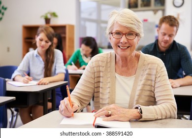 Happy Senior Woman At An Adult Education Class Looking To Camera