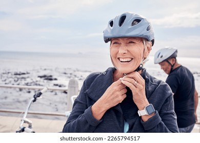 Happy senior woman, bicycle and helmet on holiday ride at beach for fitness workout with man. Smile on face, happiness and health, cycling exercise for mature couple on ocean vacation in Australia.