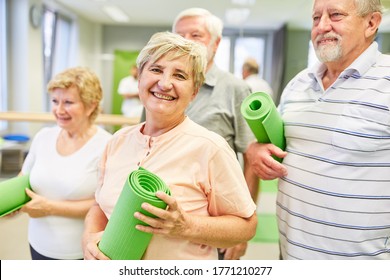 Happy Senior Woman With Friends Together In A Gym Class At The Gym