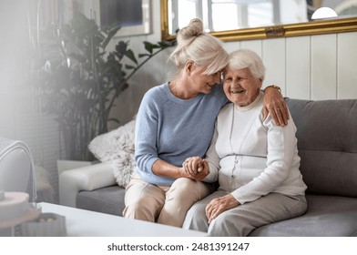 Happy senior woman with her adult daughter at home
 - Powered by Shutterstock