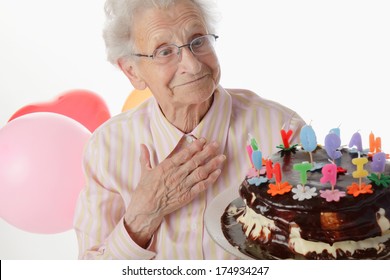 Happy Senior Woman Holding Her Birthday Cake.