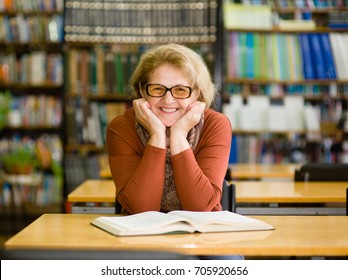 Happy Senior Woman In Library.