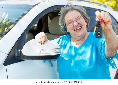 Happy Senior Woman With New Car And Keys.