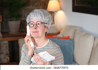 Happy Senior Woman Using Retro Style Landline Phone  