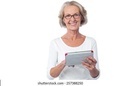 Happy Senior Woman Using Tablet Computer