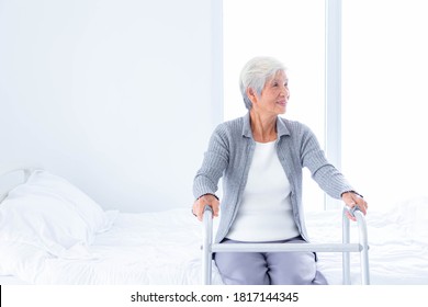 Happy senior woman with walker at bedroom. - Powered by Shutterstock