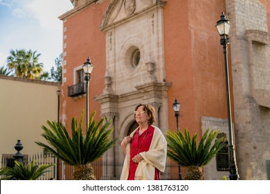 Happy Senior Woman Walking Around A Mexican Catholic Church Square. Plaza Fundadores, Durango, México.