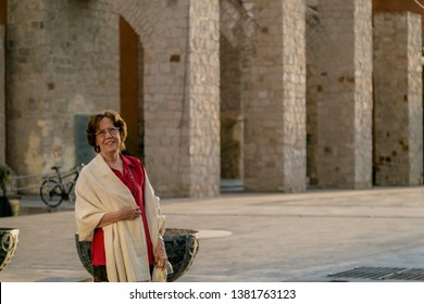 Happy Senior Woman Walking Around A Mexican Catholic Church Square. Plaza Fundadores, Durango, México.