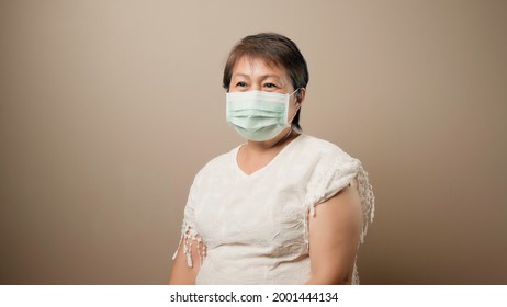 Happy Senior Woman Wearing Mask After Vaccinated, Ideas For Senior Citizen Getting Fully Vaccinated, No Side Effects From Covid Vaccine, Encourage Older Adults To Getting Vaccine, Covid Free