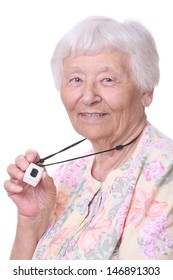 Happy Senior woman wearing a medical emergency panic button pendant 