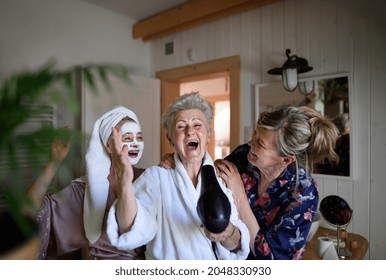 Happy Senior Women Friends In Bathrobes Having Fun Indoors At Home, Selfcare Concept.