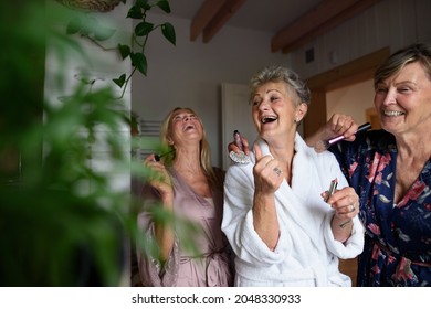 Happy Senior Women Friends In Bathrobes Having Fun Indoors At Home, Selfcare Concept.