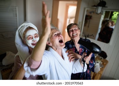 Happy Senior Women Friends In Bathrobes Having Fun Indoors At Home, Selfcare Concept.