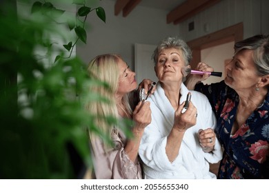 Happy Senior Women Friends In Bathrobes Doing Make Up Indoors At Home, Selfcare Concept.