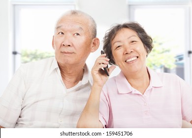 Happy Seniors Couple Talking On The Phone