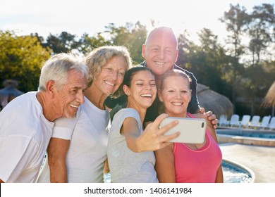 Happy Seniors As A Tour Group Take A Selfie With The Smartphone